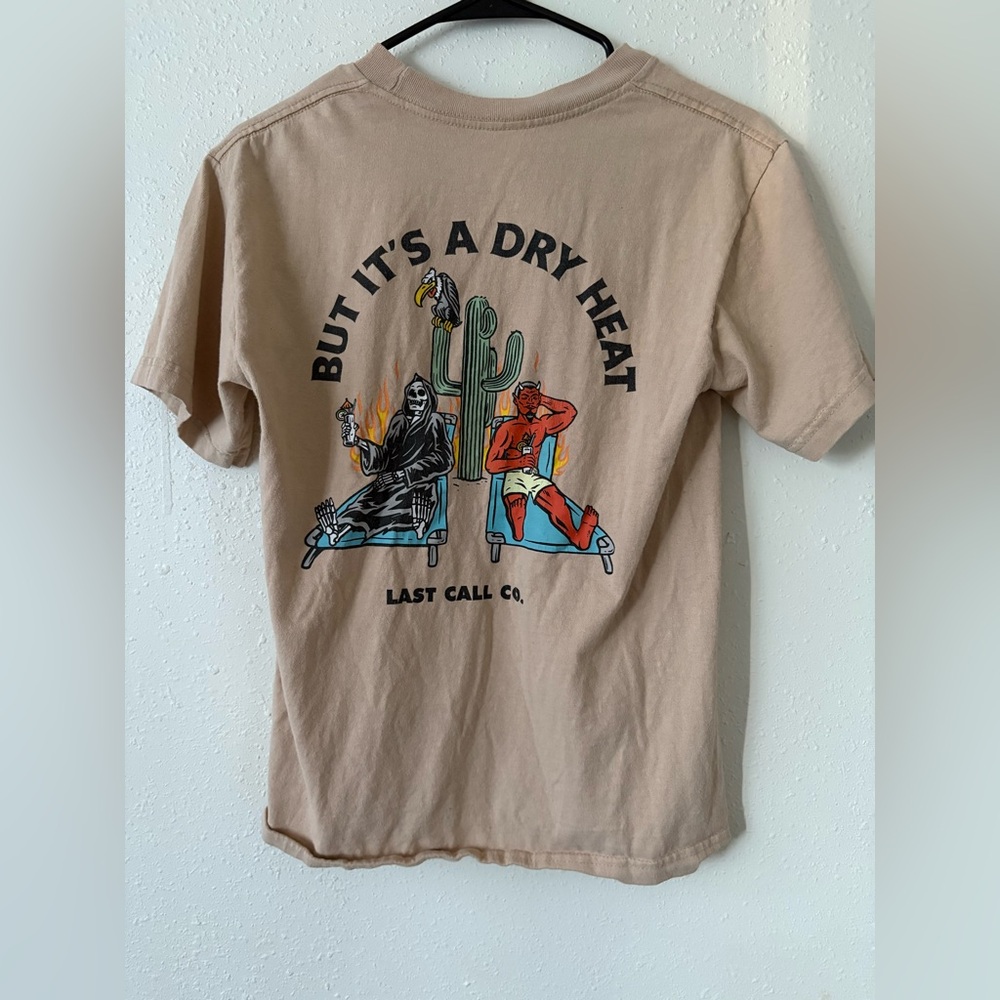 Last Call Co. “But It’s a Dry Heat” Graphic Tee | Desert Devil Skeleton Shirt